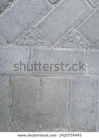 Paving block or ampar stone is a building material composition made from a mixture of Portland cement or other hydraulic adhesives,
