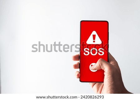 Man got emergency or SOS alert for emergency accident hot line 911 and ambulance concept. Royalty-Free Stock Photo #2420826293