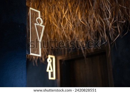 Toilet or restroom sign in lighting style