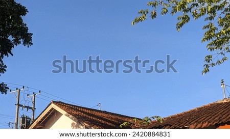 photo of blue sky above the roof