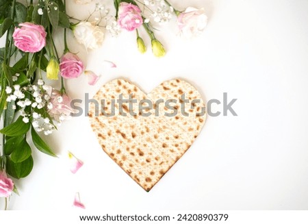 Passover. banner of Traditional Matzo shape of star heart decorate by pink flower on white background. top view. Holiday of Jewish people, Spring Holiday. Fasting time