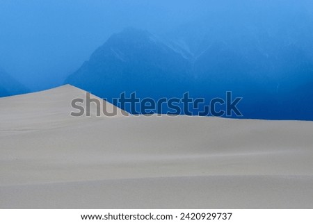 Kodar National Park, Chara Sands. Unique place,  the northernmost sandy desert with high dunes among the forest-tundra, surrounded by mountain ranges. Royalty-Free Stock Photo #2420929737