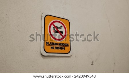 No smoking signs are posted on the walls
