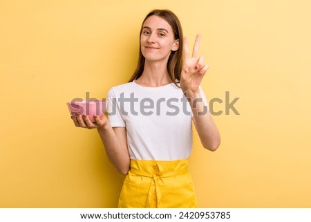 young adult pretty chef woman with an empty bowl