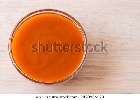 Buffalo Sauce in a Bowl Royalty-Free Stock Photo #2420956023