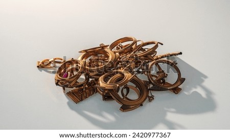A scrap of gold. Old and broken jewelry, watches of gold and gold-plated lies in a pile.