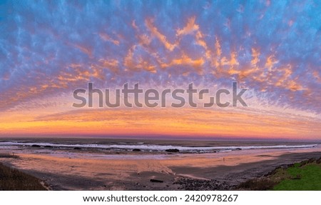 Beautiful orange, yellow, pink and blue sunrise of the Pacific Ocean in panoramic format. No dta licensing. Royalty-Free Stock Photo #2420978267