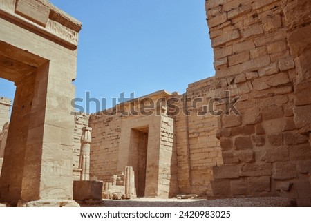 the Temple of Ramses III at Medinet Habu doesn’t get as much airtime as Karnak Temple and Luxor Temple, it’s most definitely worth seeing. While smaller, this temple has some of the most vividly color Royalty-Free Stock Photo #2420983025