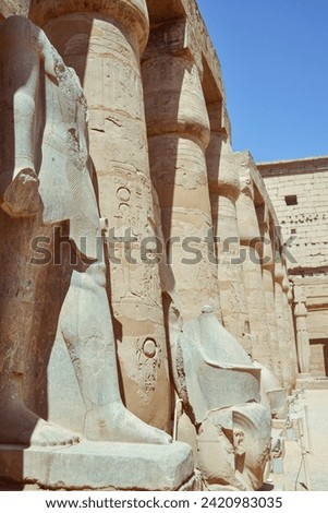 the Temple of Ramses III at Medinet Habu doesn’t get as much airtime as Karnak Temple and Luxor Temple, it’s most definitely worth seeing. While smaller, this temple has some of the most vividly color Royalty-Free Stock Photo #2420983035