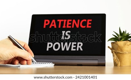 Patience is power symbol. Concept words Patience is power on beautiful tablet screen. Beautiful wooden table white background. Businessman hand. Business and patience is power concept. Copy space.