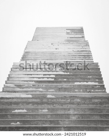 Stairs to nowhere. Empty unfinished bridge. Outdoor staircase without end. Stairway to heaven. Bridge under construction. Stairs against cloudy sky. Steps to heaven. Lifestyle background.  Royalty-Free Stock Photo #2421012519