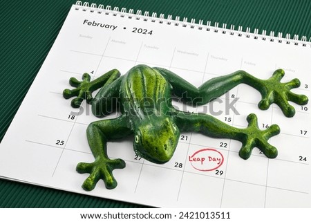 Happy Leap Day on 29 February with Jumping Frog Royalty-Free Stock Photo #2421013511