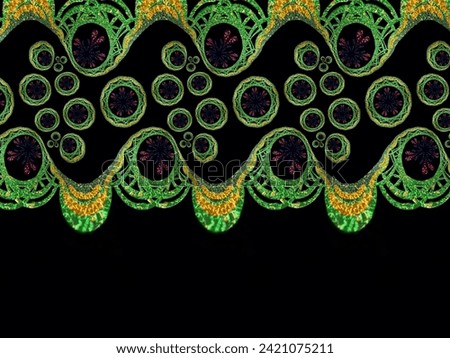 A hand drawing pattern made of yellow pink blue and green on a black background