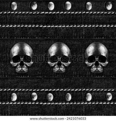 Seamless texture photo of black leather stitched belt with metal skulls and rivets engraving.