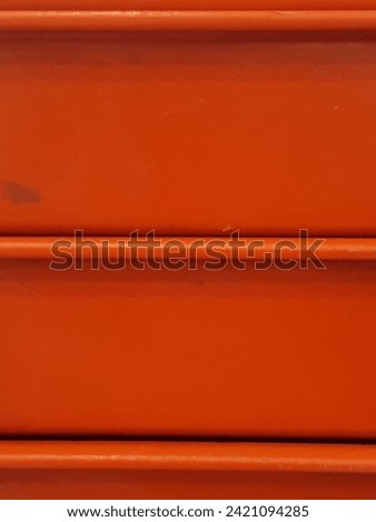 abstract photo of straight lines on orange objects good for background