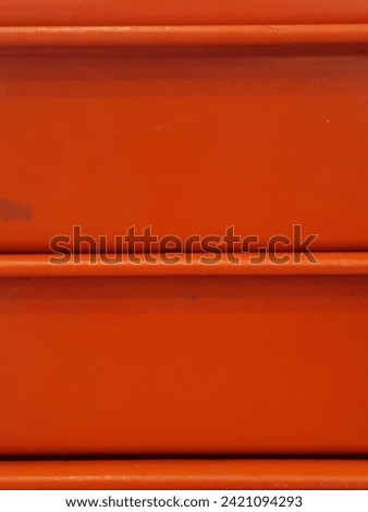abstract photo of straight lines on orange objects good for background