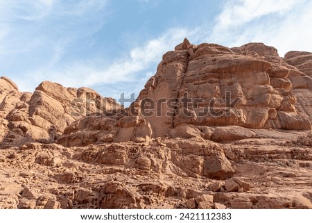 Bizarre  shapes of the high mountains in the red desert of the Wadi Rum near Amman in Jordan