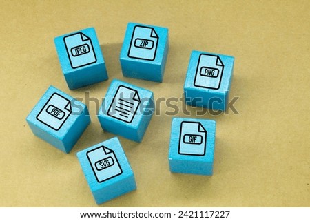 blue wooden square with formats file icons. the most common file formats and discuss what makes them unique Royalty-Free Stock Photo #2421117227