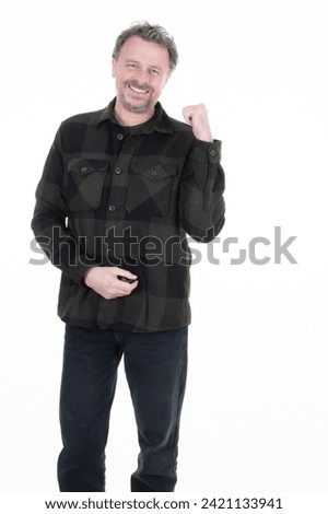 smiling middle aged handsome man pointing back with beard standing over white background with happy and cool smile on face lucky person