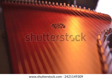 Gusli (national slavic harp), slavic psaltery Royalty-Free Stock Photo #2421149309