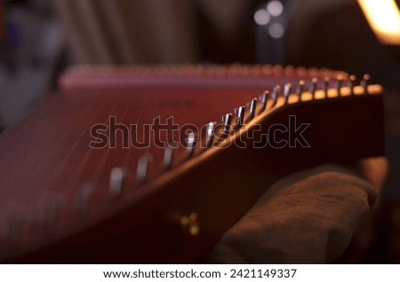 Gusli (national slavic harp), slavic psaltery Royalty-Free Stock Photo #2421149337