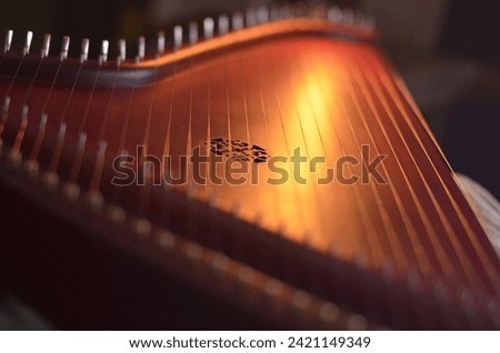 Gusli (national slavic harp), slavic psaltery Royalty-Free Stock Photo #2421149349