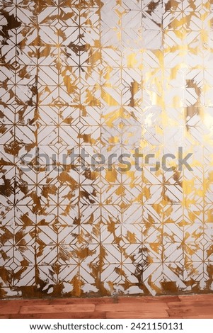 the texture of a golden wall with putty elements. a gilded wall made by hands. ready-made background for photo shoots in a photo studio