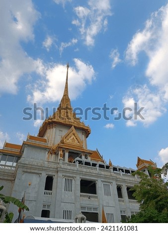 Wat Traimit is a Buddhist temple in Bangkok, Thailand. It is known for its large golden Buddha statue, which is made of solid gold and weighs over 5 tons.