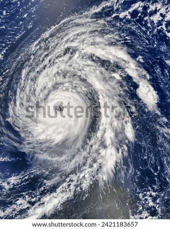 Hurricane Bill. With a wellformed eye and a symmetrical shape, Hurricane Bill looked the part of the major hurricane it was forecast to become. Elements of this image furnished by NASA. Royalty-Free Stock Photo #2421183657