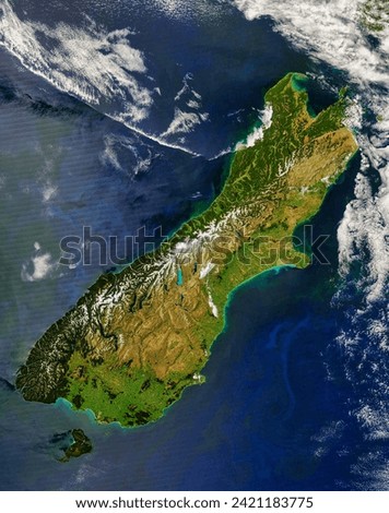The South Island, New Zealand. Colors ranging from deep brown to stark white give New Zealands South Island its intense beauty. The. Elements of this image furnished by NASA. Royalty-Free Stock Photo #2421183775