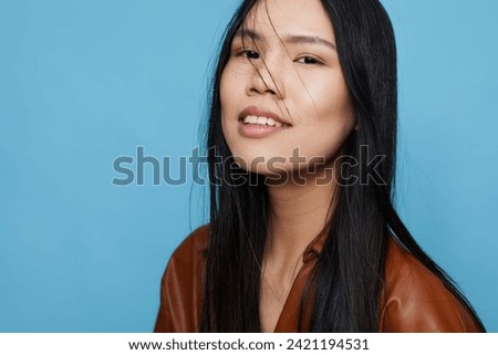 Background woman lifestyle attractive smile blue trendy girl beauty studio asian portrait happy