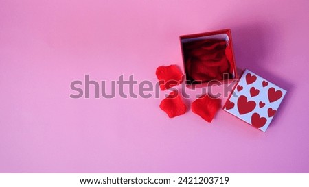 Valentine's day gift box. Happy valentines day banner design with present box and roses on pink background. Copy space.