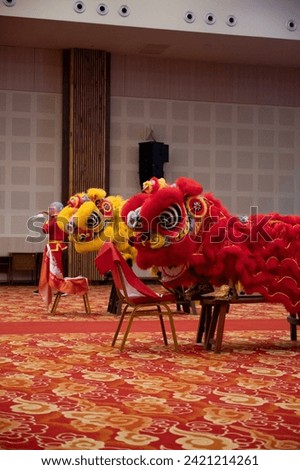 A traditional Chinese dance "Lion Dance" being performed in a school auditorium