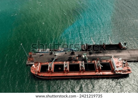 Aerial top view of Container ship loading and unloading,
