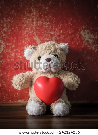teddy Bear with Heart  old grunge background,concept valentine ,vintage retro tone