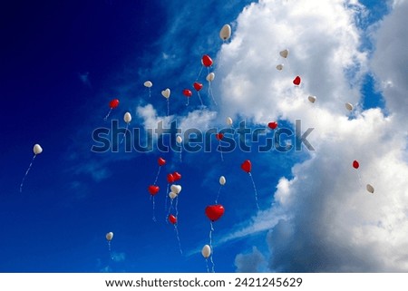 "Romantic love balloon soaring against a dreamy sky, a whimsical symbol of affection and joy. Ideal for conveying love and celebration in creative projects."