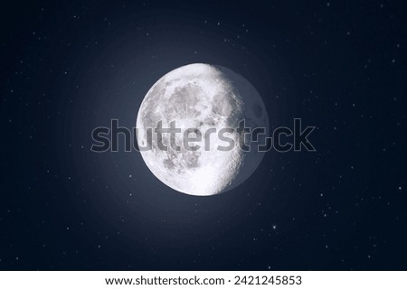 Gibbous moon in starry background sky 