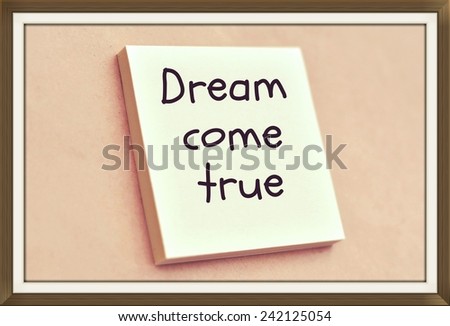 Text dream come true on the short note texture background