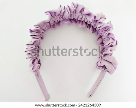 Women's hair headband with wave pattern in light purple on a white background 