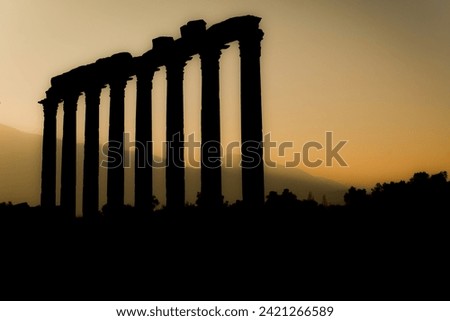 A silhoutte detail of an ancient temple of Euromos in Milas Turkey Royalty-Free Stock Photo #2421266589