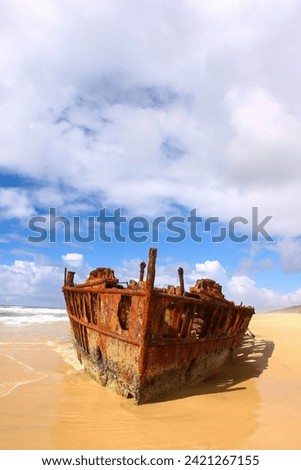 SS Maheno shipwreck half buried in the sand of the 75 mile beach on the east coast of Fraser Island in Queensland, Australia - It washed ashore during a cyclone in 1935 when on route from New Zealand Royalty-Free Stock Photo #2421267155