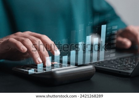 Digital online marketing concept. Financial and investment business planning and development. Person use laptop analyzing growth sales data graph on modern interface icon.
