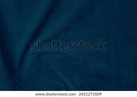 Dark blue velvet fabric texture used as background. silk color denim fabric background of soft and smooth textile material. crushed velvet .luxury navy blue dark tone for silk.