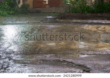 view of wet ground after rain at night Royalty-Free Stock Photo #2421280999