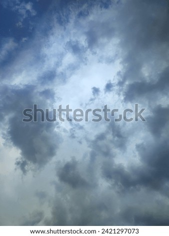 Overcast skies during a thunderstorm in summer  Royalty-Free Stock Photo #2421297073