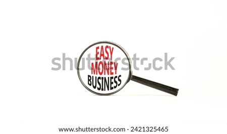 Easy money business symbol. Concept words Easy money business in beautiful magnifying glass. Beautiful white table white background. Easy money business concept. Copy space.