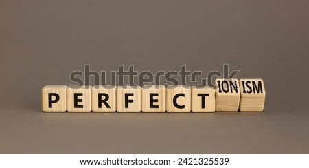 Perfectionism symbol. Concept words Perfect or Perfectionism beautiful wooden blocks. Beautiful grey table grey background. Business and perfectionism or perfect concept. Copy space.