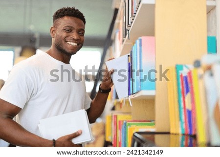 A happy and cheerful student in a library, surrounded by books, exuding confidence and joy in academic pursuits.