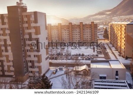 View of a town in winter season.Mountains in background. High quality photo