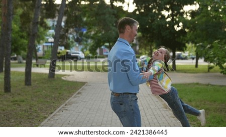 happy family, father spinning child his arms, playing superhero, children running park sunset, summer sports, classes, physical education, playing game, flying, actively engage sports, children legs